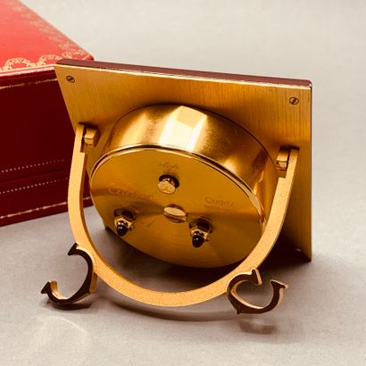 CARTIER

Square clock with Roman numerals...