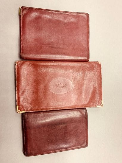 CARTIER

Burgundy leather wallet, two card...