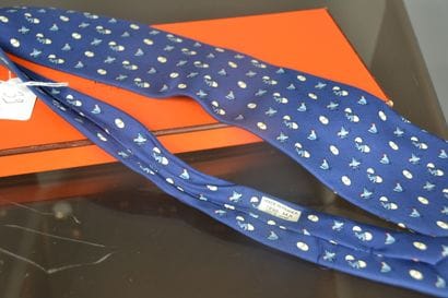 *HERMES

Blue silk tie decorated with chickens...