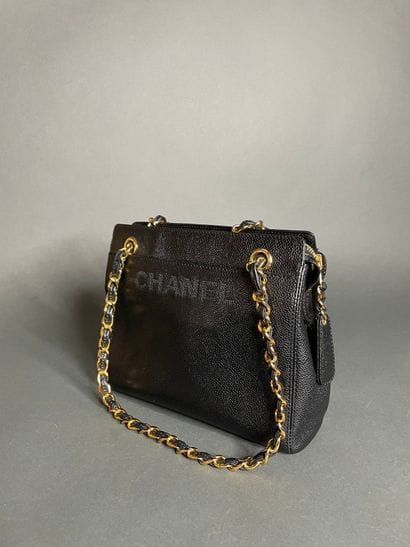 
CHANEL

Black calfskin bag, front embroidered...