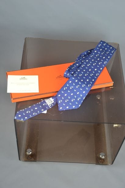 *HERMES

Blue silk tie decorated with chickens...