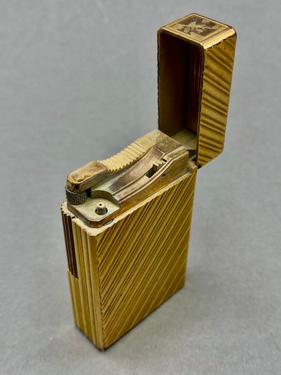 DUPONT

Three gilded metal lighters, one...