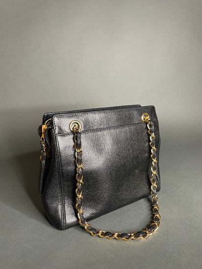 
CHANEL

Black calfskin bag, front embroidered...