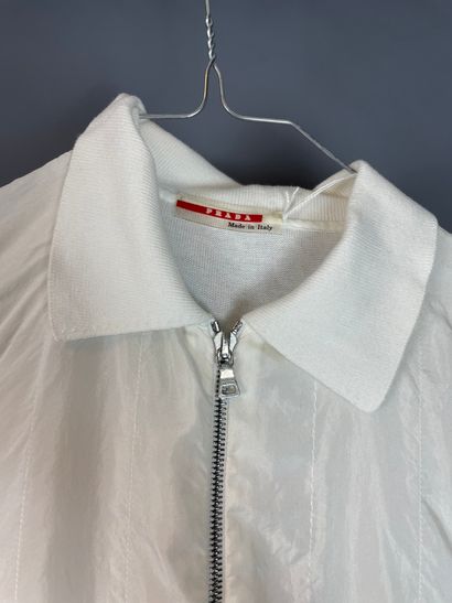 Lot of clothes including : 

PRADA

- White...