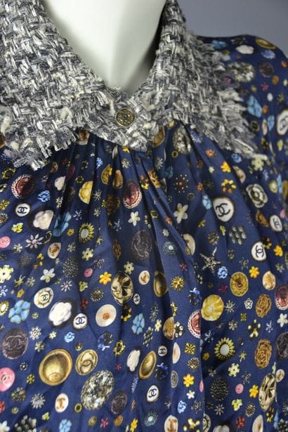 *CHANEL

Silk blouse with Chanel buttons...