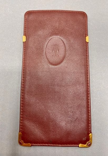 CARTIER

Burgundy leather wallet, two card...