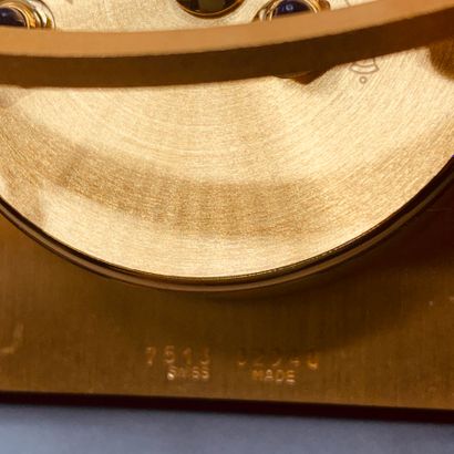 CARTIER

Square clock with Roman numerals...