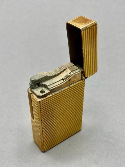 DUPONT

Three gilded metal lighters, one...