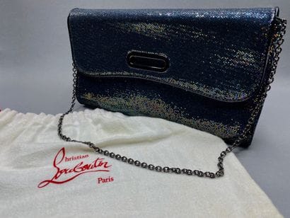 Christian LOUBOUTIN

Pochette en cuir verni...