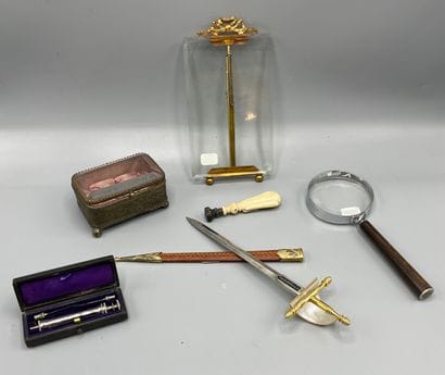 Small lot including: a letter opener, a syringe...