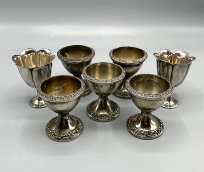 Set of five silver plated egg cups, the top...