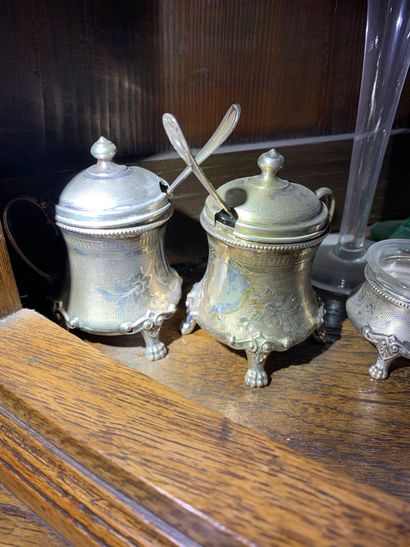 
A pair of tripod mustard pots in silver...