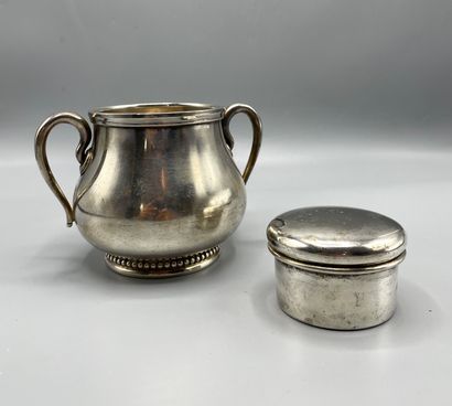 Silver plated sugar bowl, flanked by two...