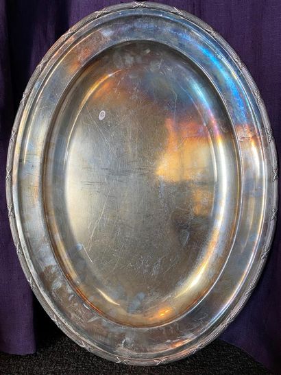 Oval dish in silver plated metal, the border...