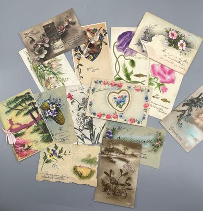 A set of postcards including paper cutouts,...