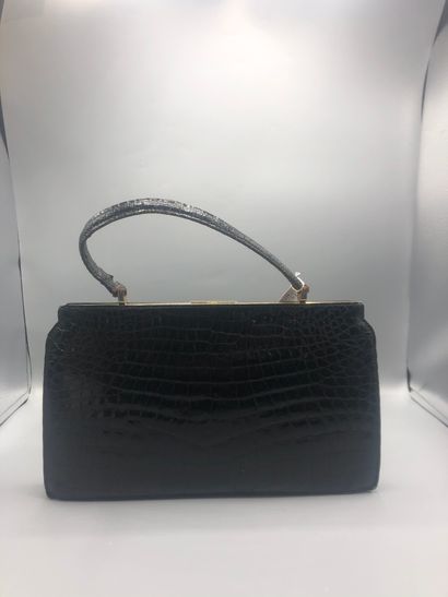 Sac en cuir noir imitation croco

Sac en...