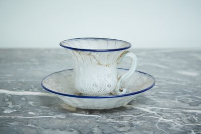 A glass cup decorated with murines.

Venice...