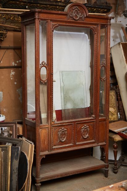 Oak display cabinet carved with garlands...