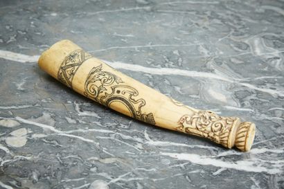 Carved ivory hunting trumpet with a coat...