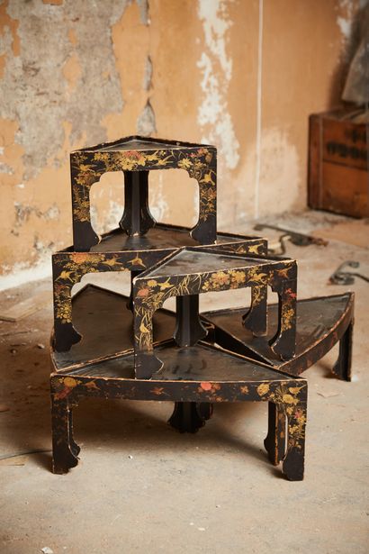 Six small lacquered tables with gilded vegetal...
