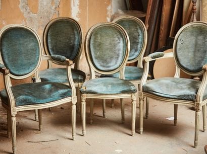 Two armchairs and three chairs in grey lacquered...