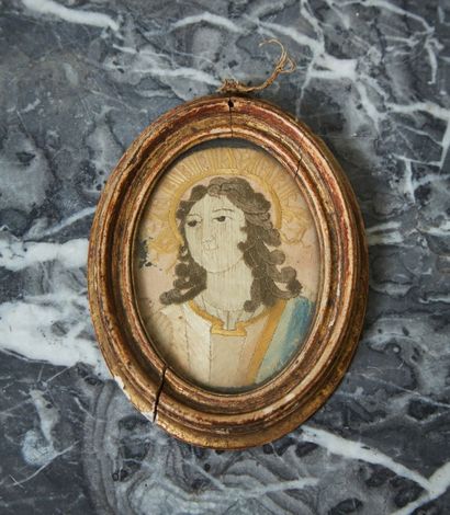 Bust representing a holy person in embroidery.

18th...