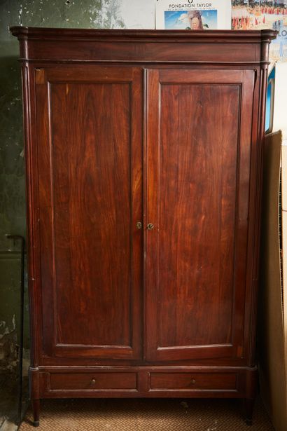 Mahogany cabinet with two large doors, fluted...