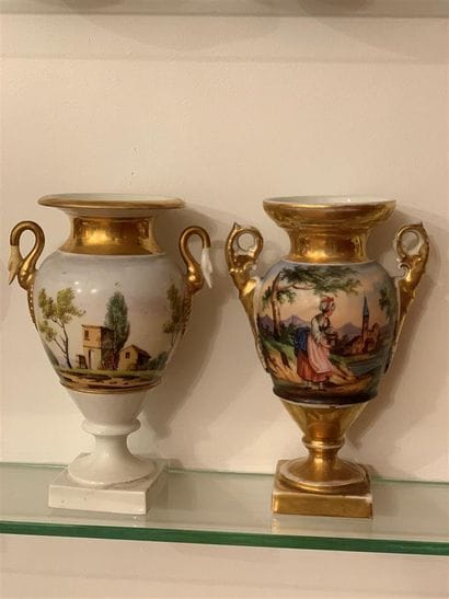 Deux vases en porcelaine polychrome et dorée...