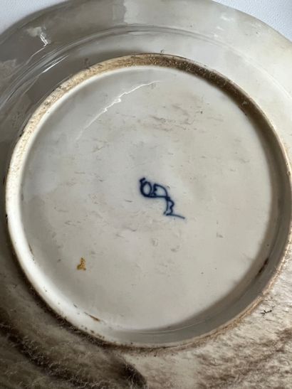 Assiette en porcelaine à décor dit 