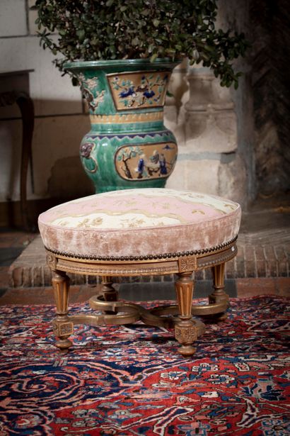 
Round stool in molded and carved wood with...