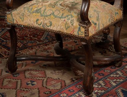 
Armchair in molded and carved natural wood,...
