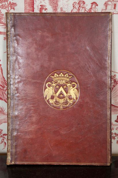 
Bound desk blotter decorated with small...