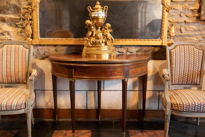 
Mahogany and mahogany veneer half-moon table...