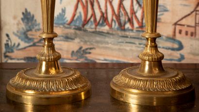 
Pair of ormolu candlesticks with foliage,...