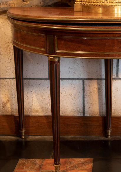 
Mahogany and mahogany veneer half-moon table...