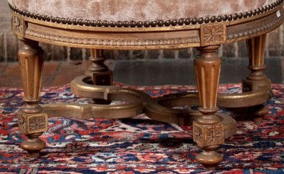 
Round stool in molded and carved wood with...
