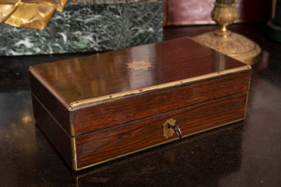 
Exotic wood box topped by a monogrammed...
