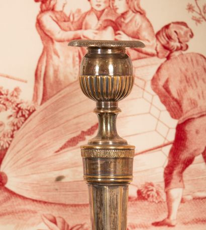 
Pair of silver plated bronze torches decorated...