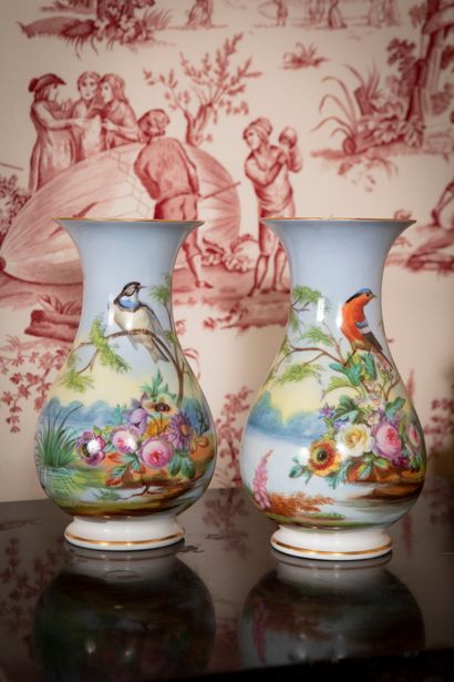 
Pair of polychrome porcelain baluster vases...