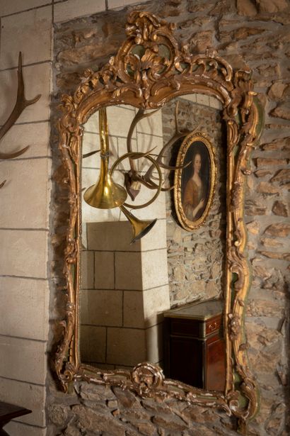 
Important carved wood mirror with green...