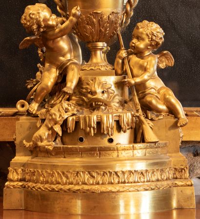 
Gilt bronze clock, the dial turning in an...