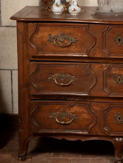 
Natural wood chest of drawers opening to...