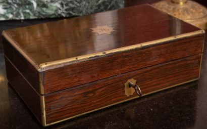 
Exotic wood box topped by a monogrammed...