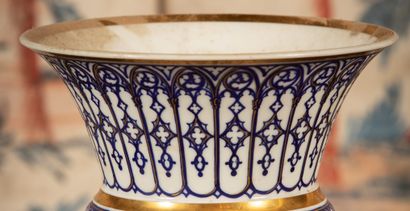 
White porcelain vase with blue and gold...