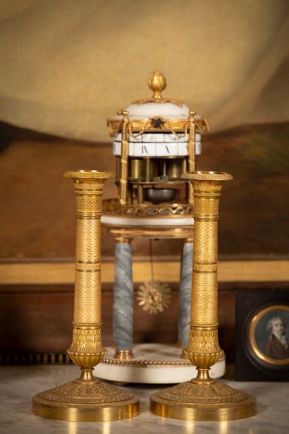 
Pair of ormolu torches with chased fish...