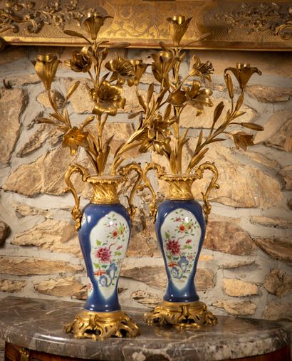 
Pair of candelabras formed by two vases...