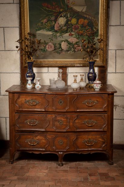 
Natural wood chest of drawers opening to...