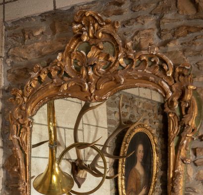 
Important carved wood mirror with green...