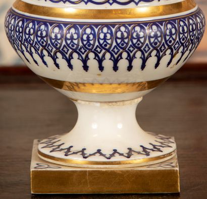 
White porcelain vase with blue and gold...