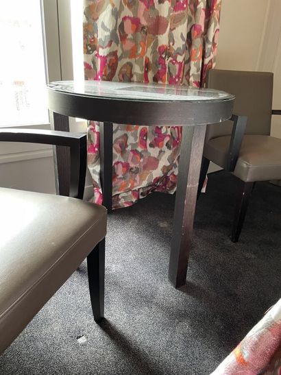 Round wooden table, black tinted mirror surface...
